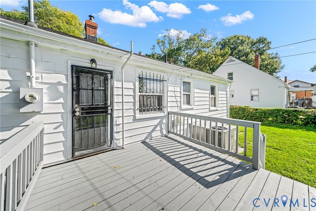 Rear wood deck with painted railing