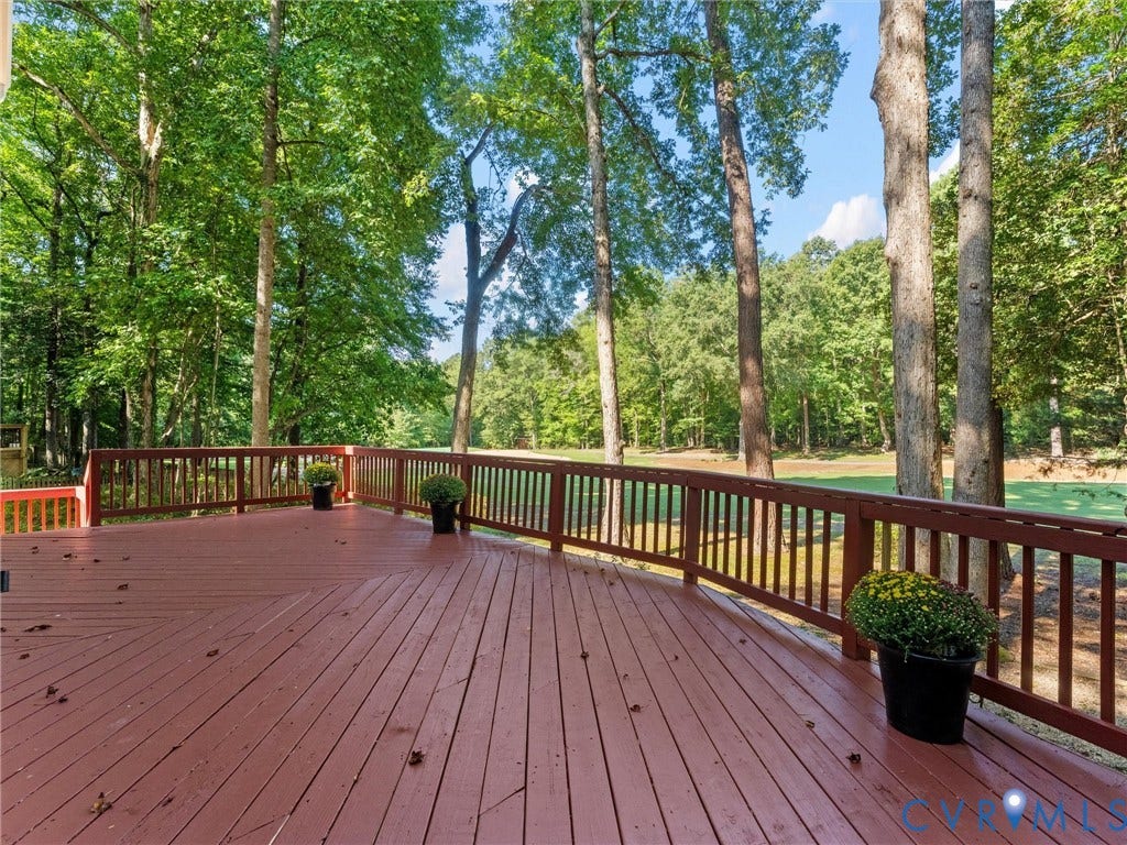 4504 Heritage Woods Lane, Heritage Woods, Midlothian, VA 23112 The expansive deck offers plenty of room for entertaining, relaxing, and taking in the beautiful golf course views, and even features reinforced support designed to accommodate a hot tub - perfect for creating your own private outdoor retreat!
