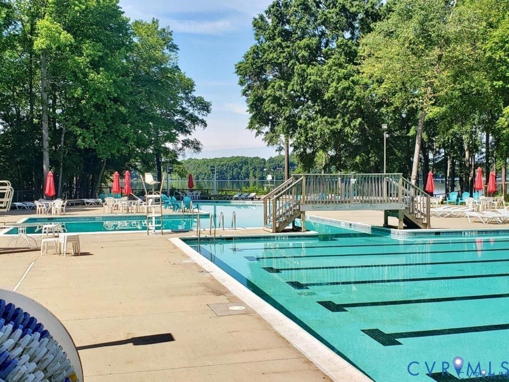 4504 Heritage Woods Lane, Heritage Woods, Midlothian, VA 23112 North Beach Pool is an Olympic size pool for swim teams, is lakefront, includes a wading pool, a waterslide, and diving board