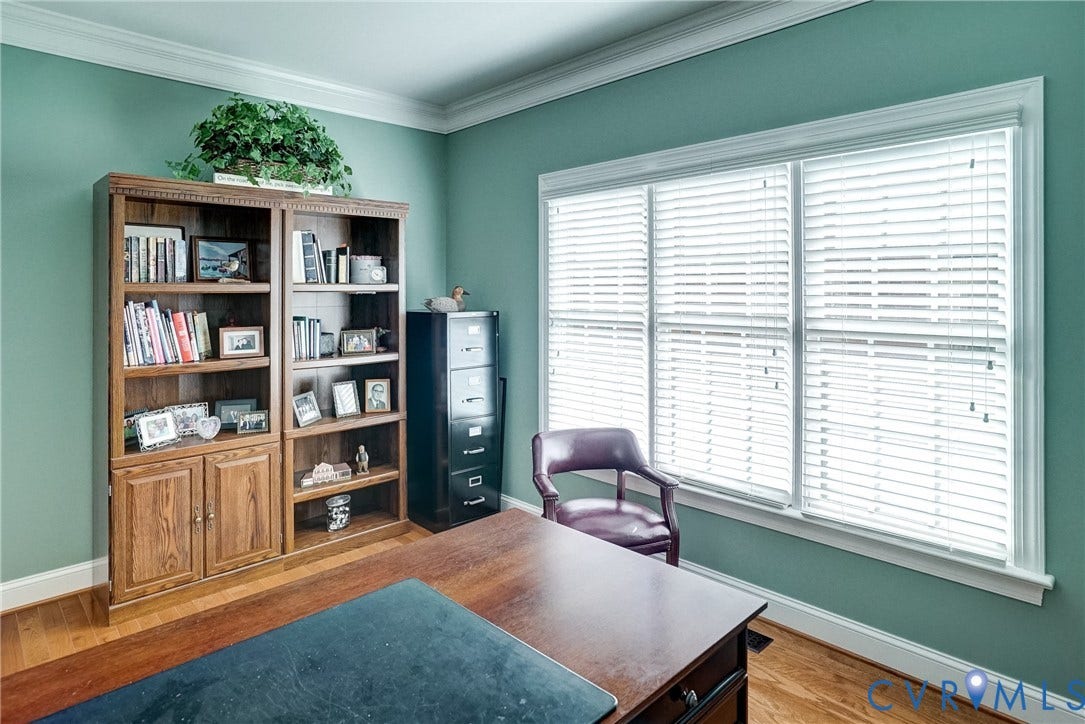 4938 Grey Oaks Villas Drive, Glen Allen, VA 23059 Wood-finish flooring, built-in shelving, crown molding, and large windows with blinds