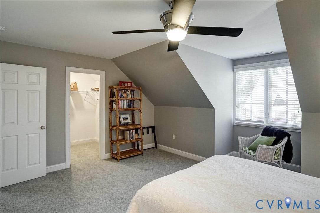 4938 Grey Oaks Villas Drive, Glen Allen, VA 23059 Sloped ceilings with recessed lighting, ceiling fan, carpet flooring, window with blinds, and walk-in closet with shelving