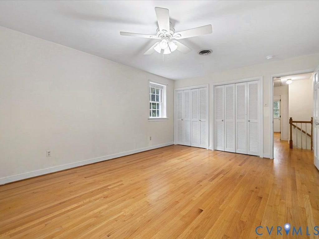 4630 Melody Court, Meadowbrook West, North Chesterfield, VA 23234 Bedroom 2 Hardwood flooring, twin bi-fold closet doors, ceiling fan with integrated lighting, and a double-hung window