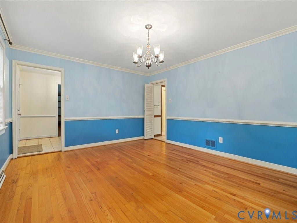 4630 Melody Court, Meadowbrook West, North Chesterfield, VA 23234 Crown molding, chair rail molding, and a chandelier.