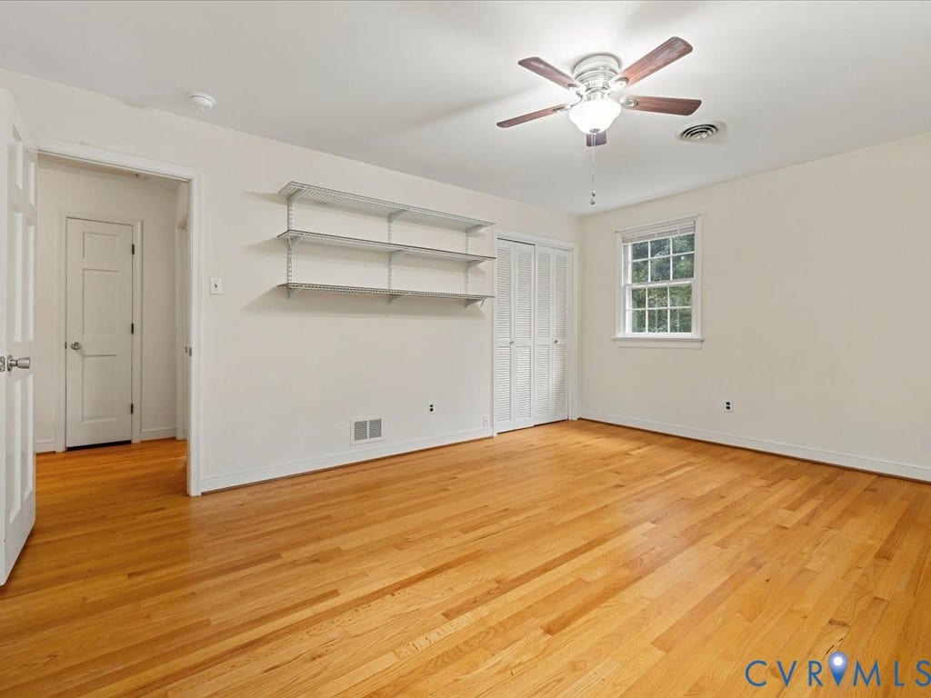 4630 Melody Court, Meadowbrook West, North Chesterfield, VA 23234 Bedroom 3 Hardwood flooring, ceiling fan with light fixture, built-in shelving, window with natural light, bi-fold closet doors
