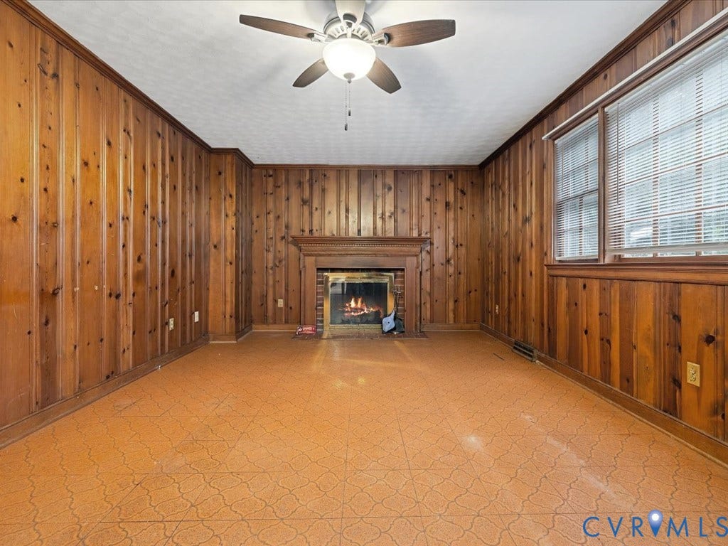 4630 Melody Court, Meadowbrook West, North Chesterfield, VA 23234 Wood-paneled walls with crown molding, a built-in fireplace with brick surround and a wood mantle.