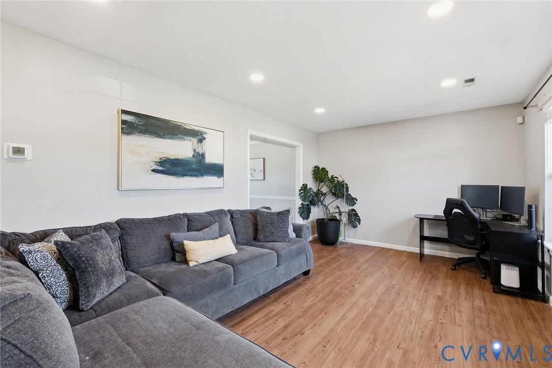4429 Crown Squire Road, Henrico, VA 23231 Recessed ceiling lighting, light-toned wall paint, wood-finish flooring, and a large window with roller shades