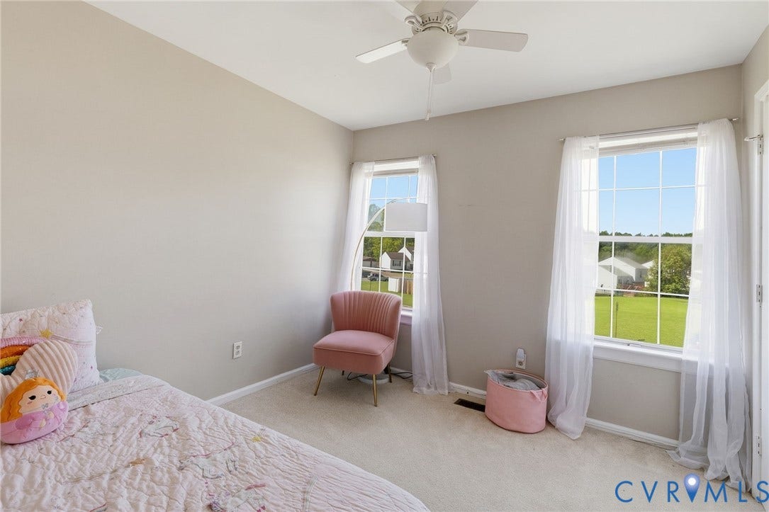 4429 Crown Squire Road, Henrico, VA 23231 Dual windows with white trim, ceiling fan, and light neutral wall color