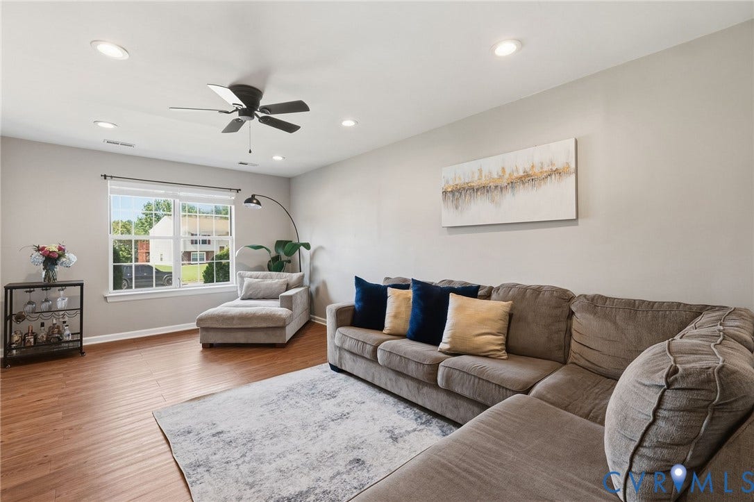 4429 Crown Squire Road, Henrico, VA 23231 Wood-finish flooring, recessed lighting, ceiling fan, and large window with white blinds
