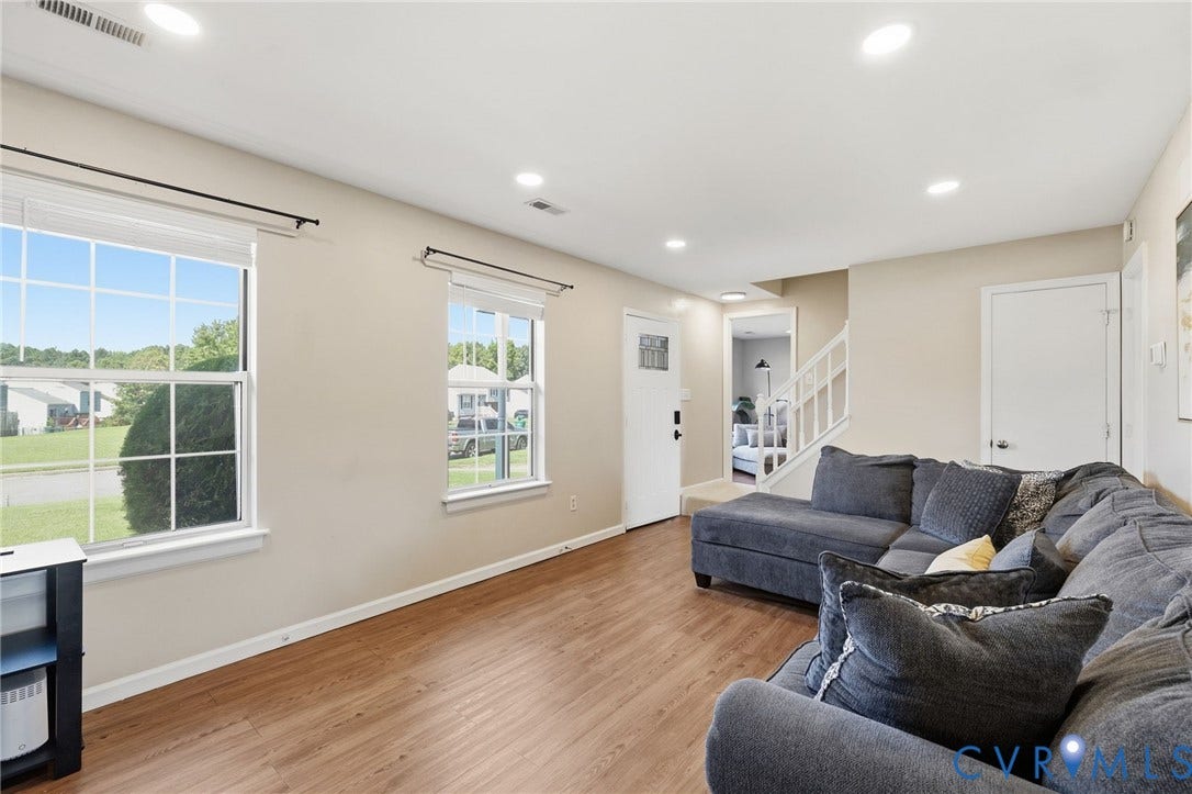 4429 Crown Squire Road, Henrico, VA 23231 Recessed lighting in a ceiling, two large windows, wood-finish flooring, and a white door with decorative glass
