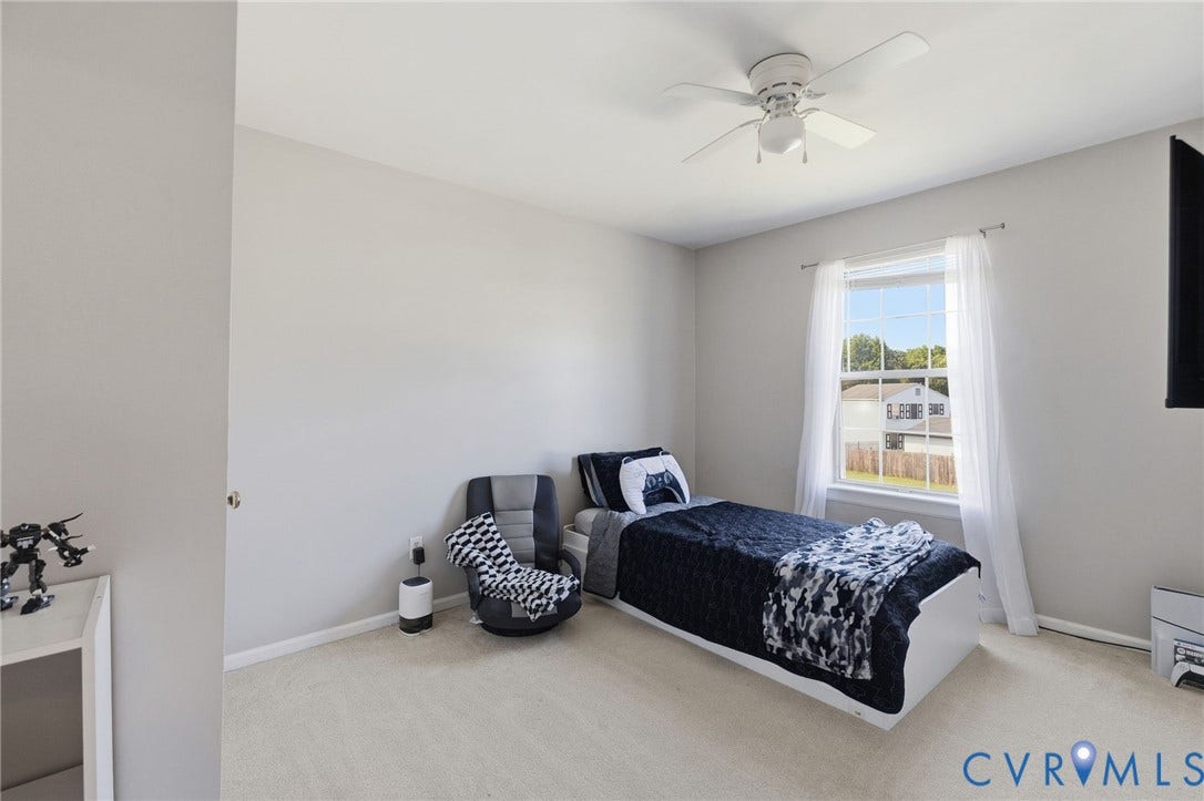 4429 Crown Squire Road, Henrico, VA 23231 Neutral wall tones, ceiling fan light fixture, carpeted flooring, and a single window with white trim