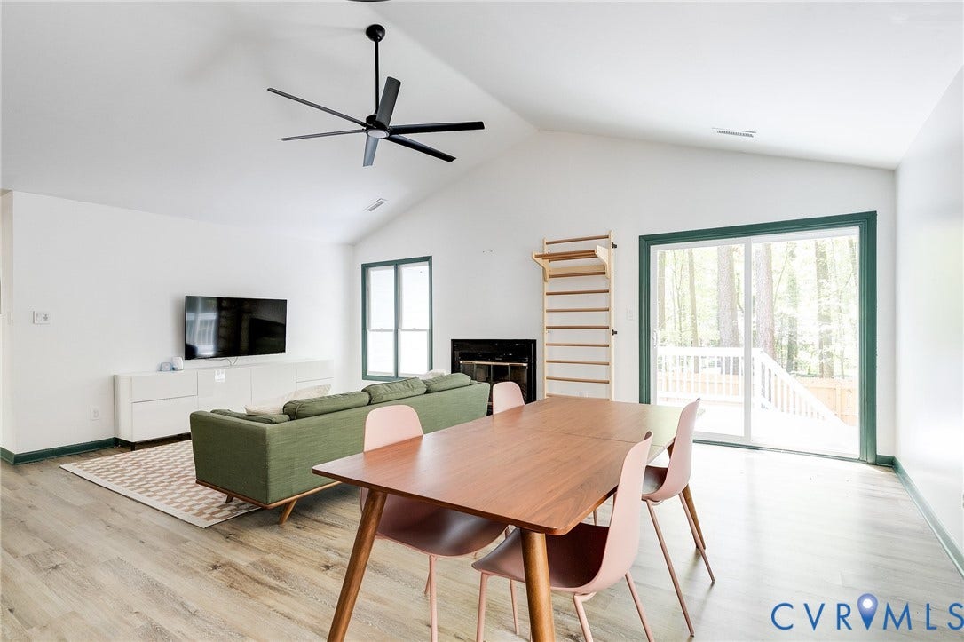 Wood-finish flooring, vaulted ceilings, and a modern ceiling fan