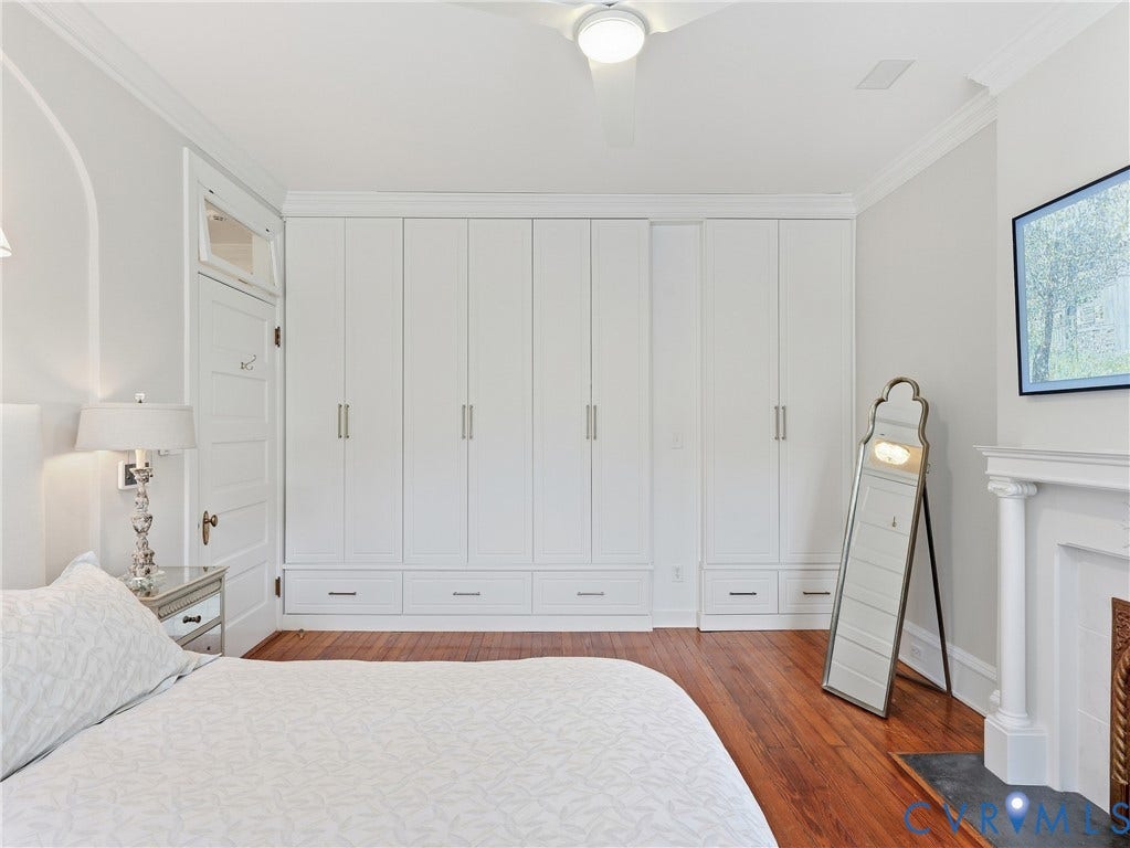 1829 Floyd Avenue, The Fan, Richmond, VA 23220 Hardwood flooring, crown molding, built-in cabinetry with integrated drawers, ceiling fan, and decorative fireplace with hearth
