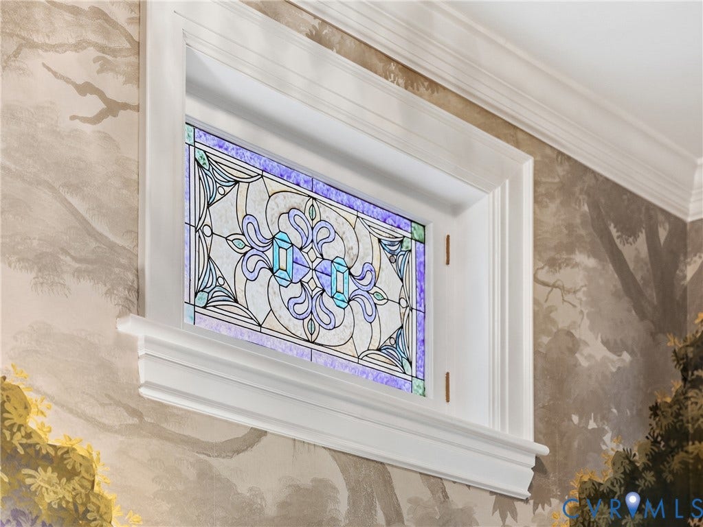 1829 Floyd Avenue, The Fan, Richmond, VA 23220 Decorative stained glass window with white trim, framed by a painted wall mural and crown molding