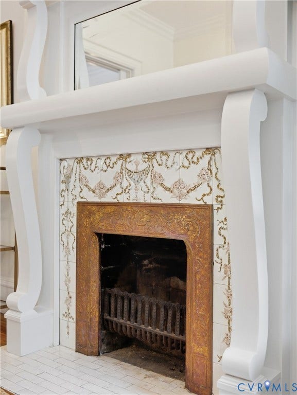 1829 Floyd Avenue, The Fan, Richmond, VA 23220 White mantel with scrolled corbels, decorative tile surround, and cast iron firebox