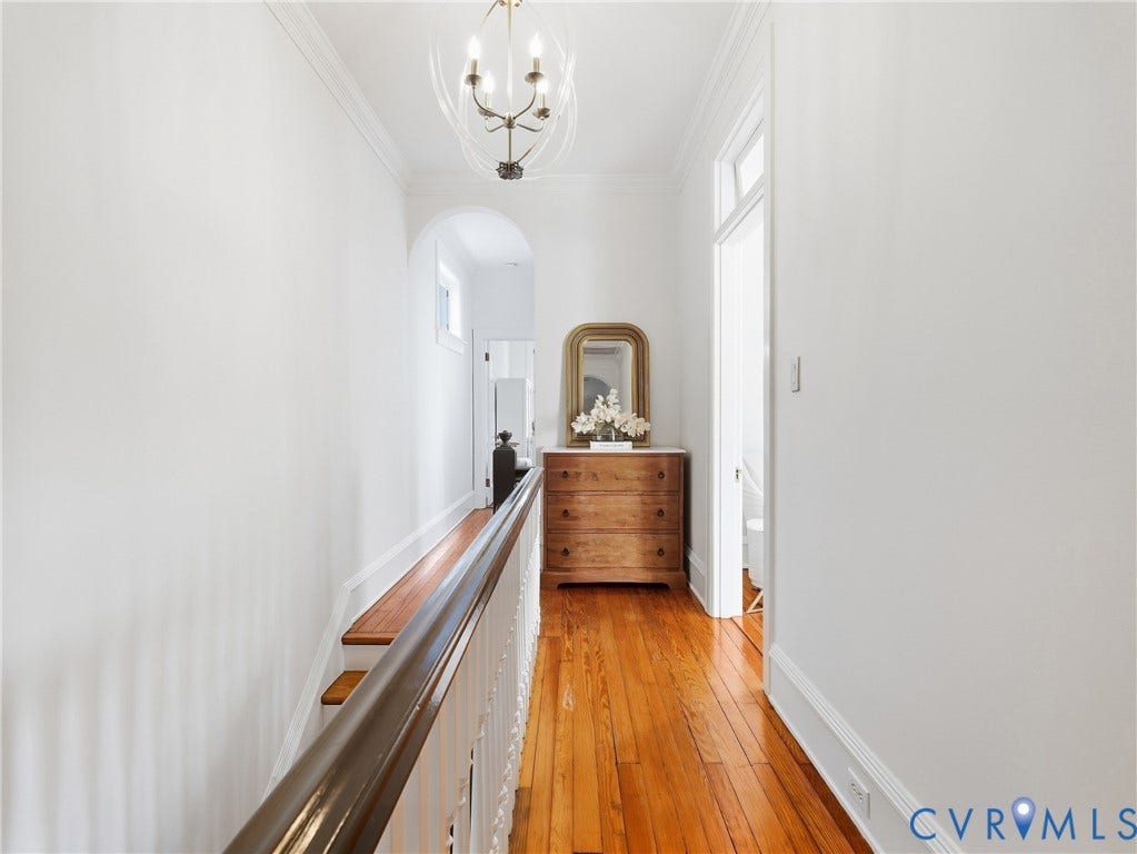 1829 Floyd Avenue, The Fan, Richmond, VA 23220 Hardwood flooring, arched doorway, chandelier lighting, crown molding, and white wall finishes