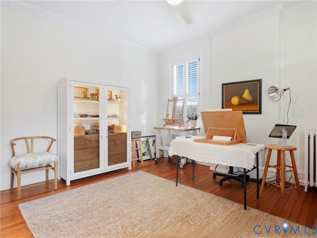 1829 Floyd Avenue, The Fan, Richmond, VA 23220 Hardwood flooring, white painted walls, crown molding, a window with louvered shutters, and a ceiling fan
