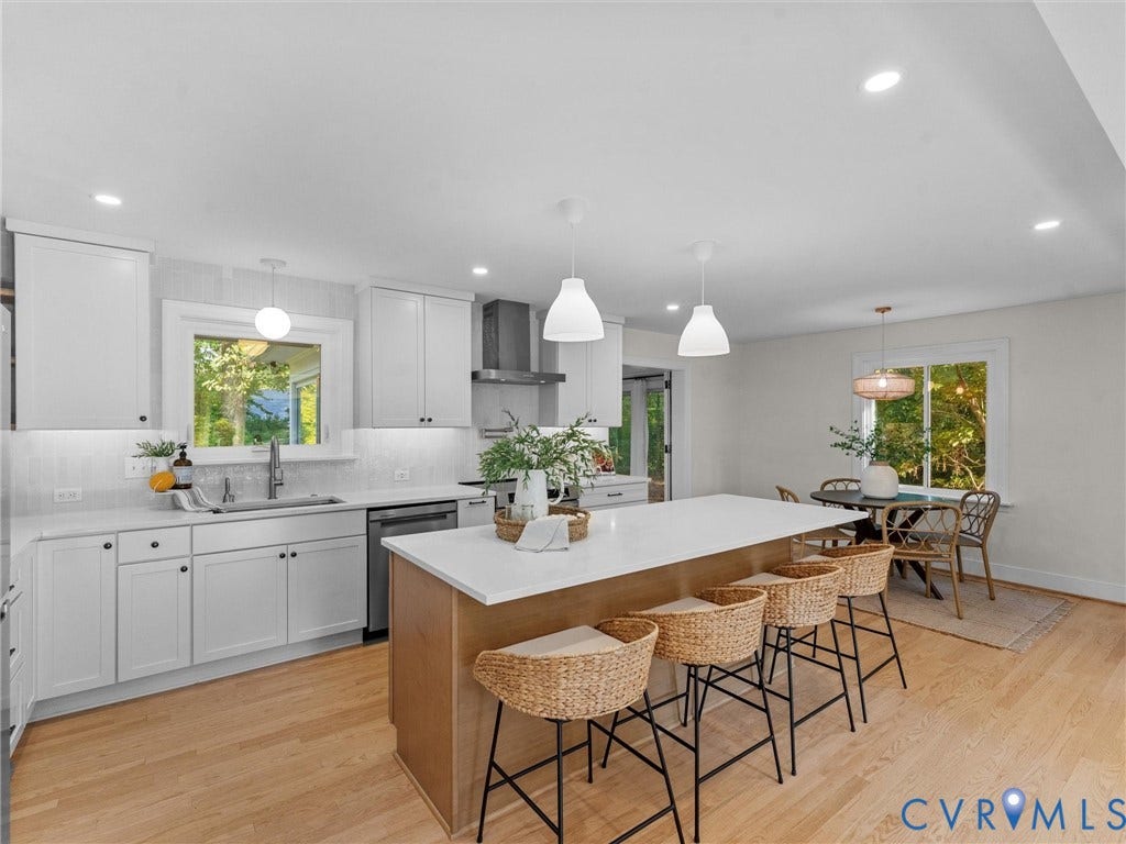 3436 Kenmore Road, Richmond, VA 23225 Open-concept kitchen with light wood-finish flooring, white cabinetry, a large kitchen island, and recessed lighting