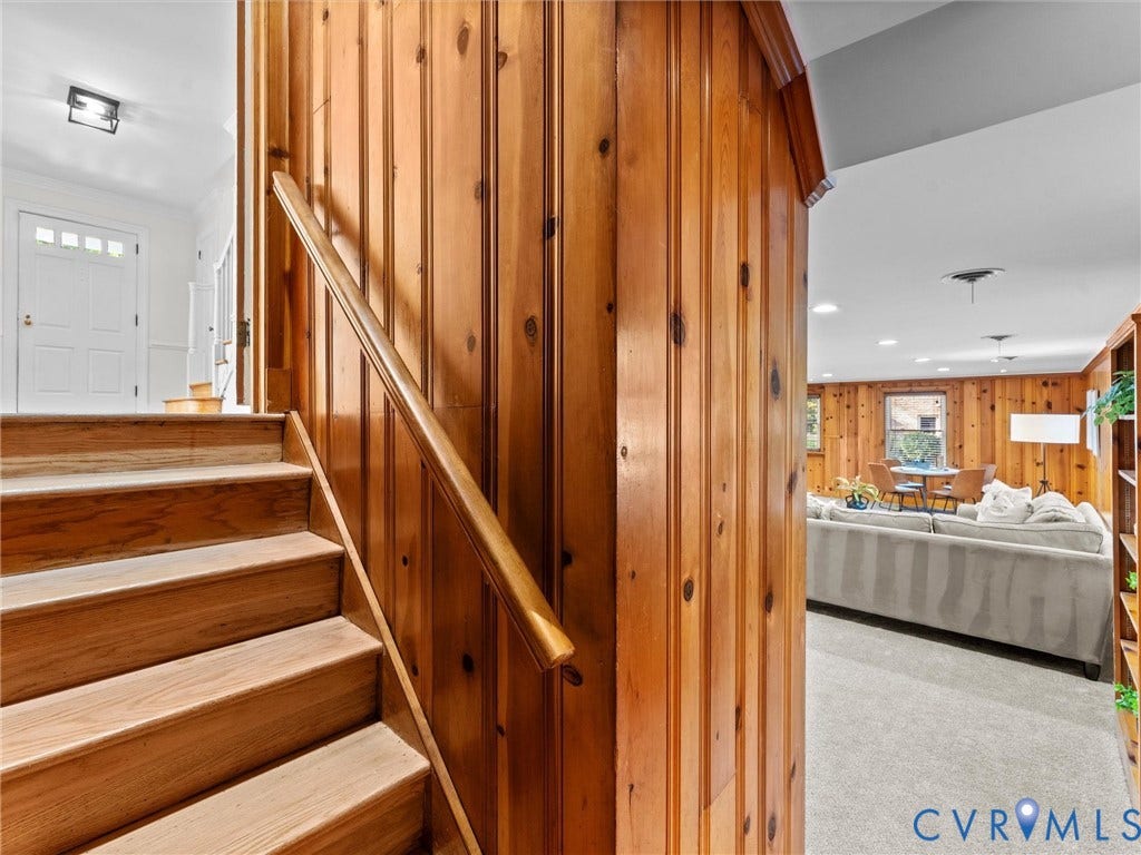 3436 Kenmore Road, Richmond, VA 23225 Natural wood paneling, wood staircase with handrail, recessed lighting, and built-in shelving