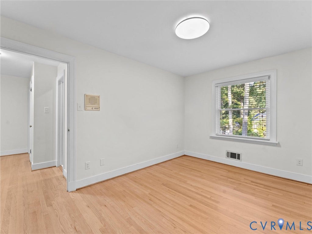 3436 Kenmore Road, Richmond, VA 23225 Hardwood-style flooring, white walls, flush-mount ceiling light, window with white blinds, and white trim throughout