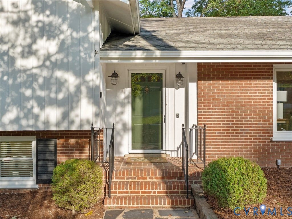 3436 Kenmore Road, Richmond, VA 23225 Brick and board-and-batten exterior with an asphalt shingle roof