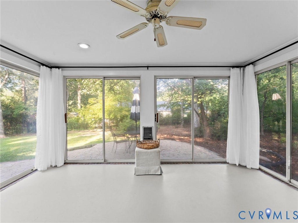 3436 Kenmore Road, Richmond, VA 23225 Bright interior space featuring a ceiling fan, recessed lighting, and expansive glass sliding doors opening to a paved patio