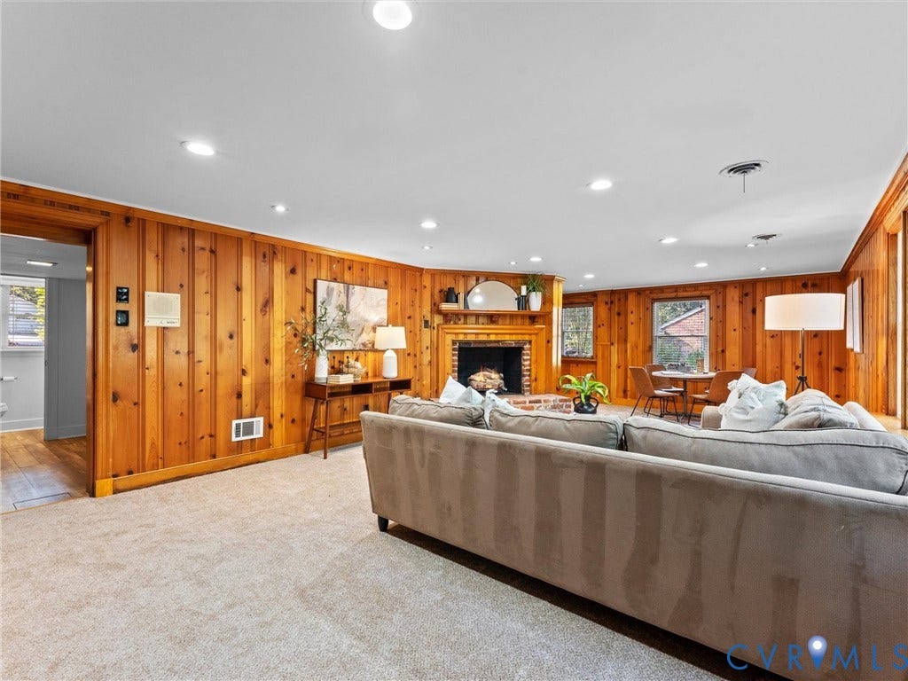 3436 Kenmore Road, Richmond, VA 23225 Wood paneling throughout, brick fireplace with wood mantel, recessed lighting, and carpet flooring