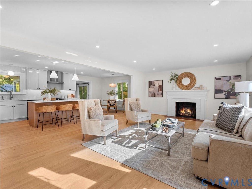 3436 Kenmore Road, Richmond, VA 23225 Open-concept living space featuring wood-finish flooring, a white-mantled fireplace, and recessed lighting