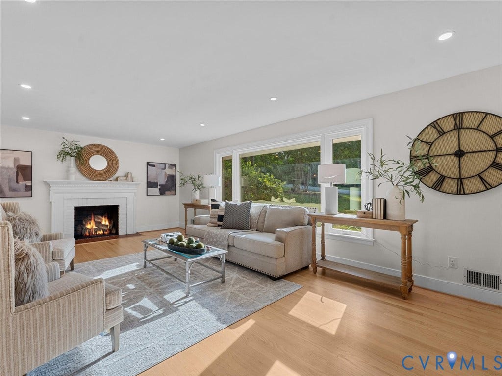 3436 Kenmore Road, Richmond, VA 23225 Hardwood flooring, white walls, large window, recessed lighting, and a white fireplace