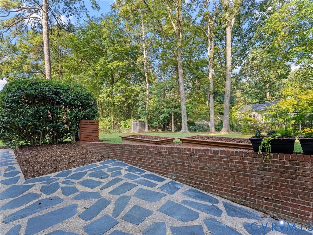 3436 Kenmore Road, Richmond, VA 23225 Stone patio with a brick retaining wall