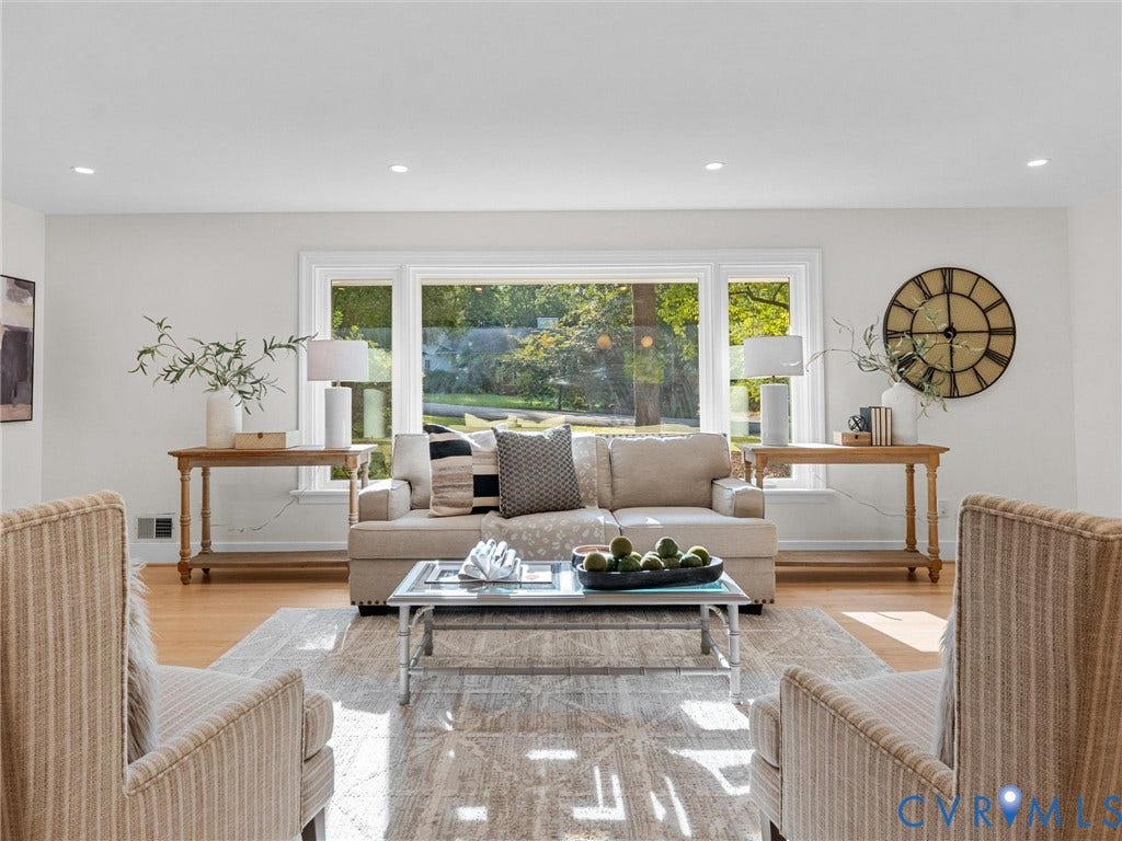 3436 Kenmore Road, Richmond, VA 23225 Bright living space featuring recessed lighting, large windows, wood-finish flooring, and crisp white walls