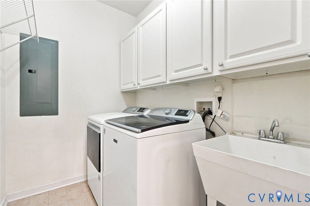 White upper cabinetry with polished chrome hardware