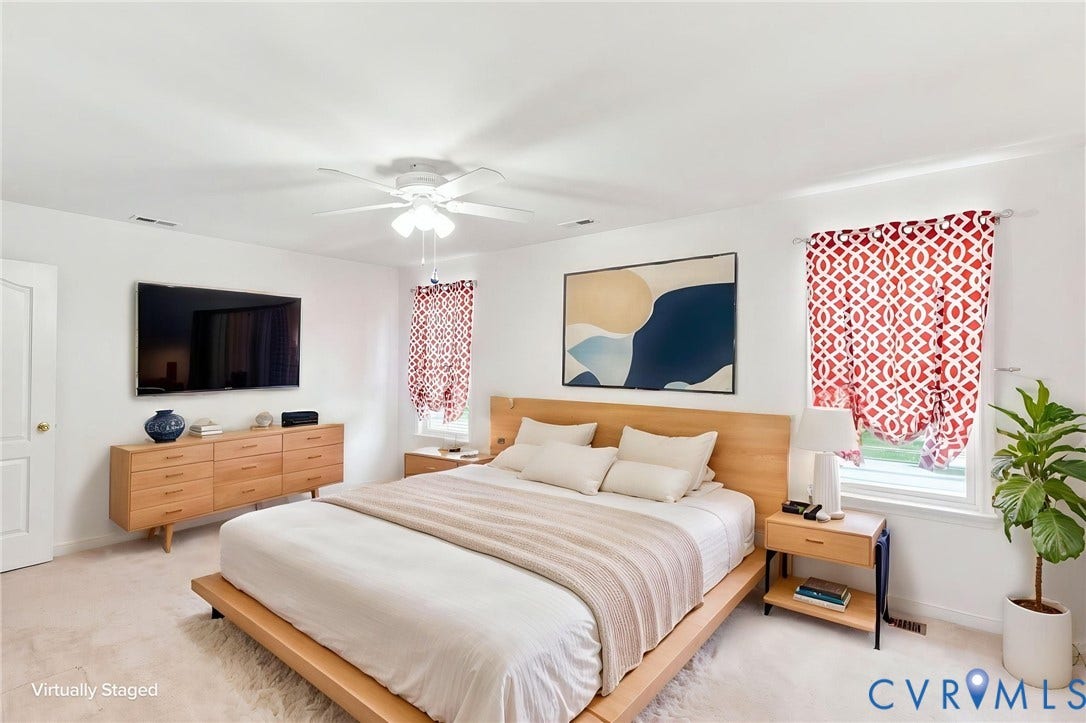 Recessed ceiling lighting, ceiling fan, white paneled door, and carpeted flooring