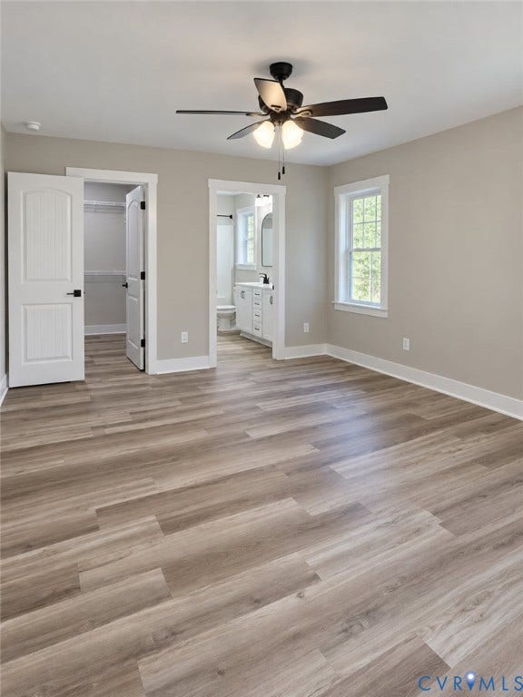 1010 Johnson Road, Mineral, VA 23117 Spacious room featuring wood-finish flooring and a ceiling fan with integrated lighting