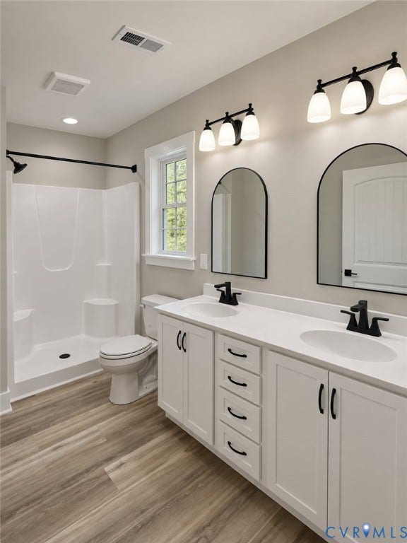 1010 Johnson Road, Mineral, VA 23117 Dual vanities with white cabinetry and dark hardware