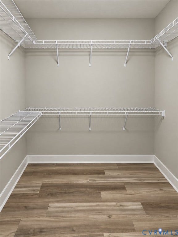 1010 Johnson Road, Mineral, VA 23117 Neutral wall paint, wood-finish flooring, white shelving system, white baseboards