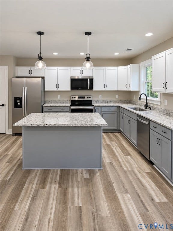 1010 Johnson Road, Mineral, VA 23117 Kitchen featuring a center island, wood-finish flooring, recessed lighting, and stainless steel appliances