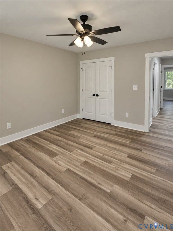 1010 Johnson Road, Mineral, VA 23117 Wood-finish flooring, white trim, and a ceiling fan with integrated lighting
