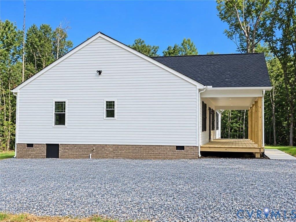 1010 Johnson Road, Mineral, VA 23117 White siding exterior with a dark asphalt shingle roof