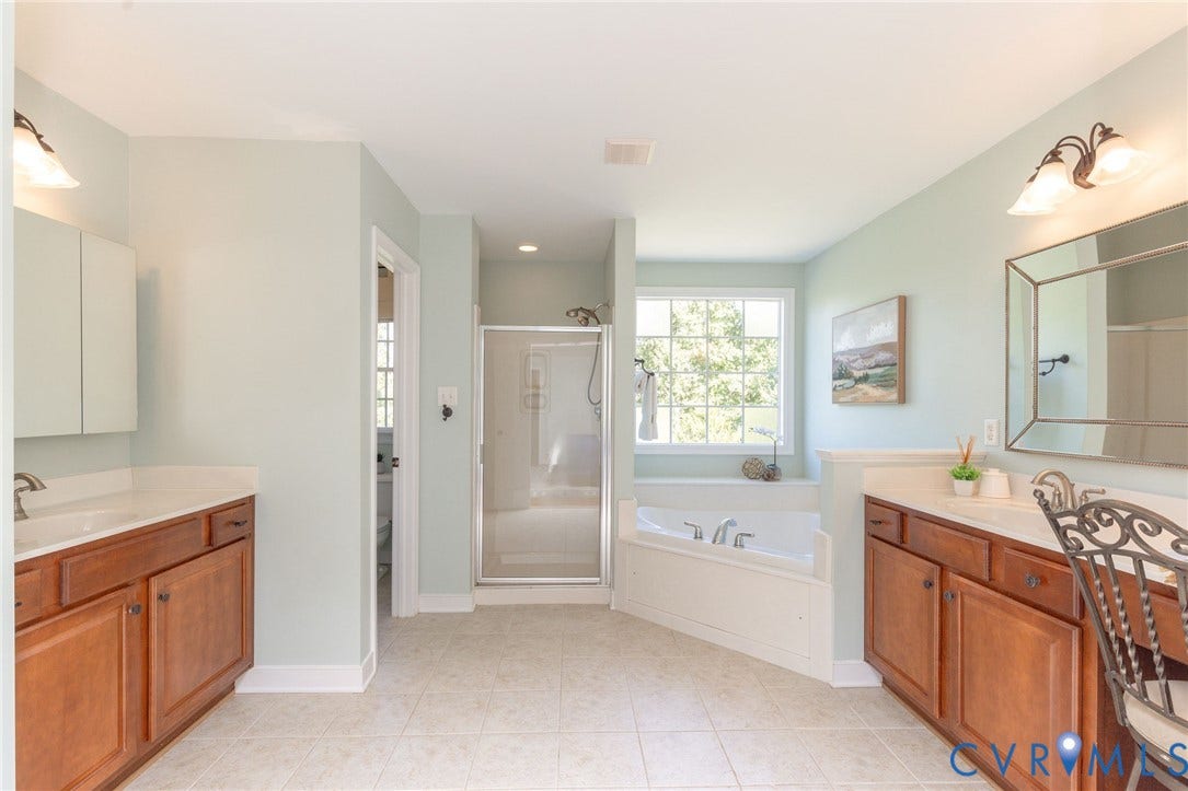 12669 Fawn Lane, Goochland, VA 23233 Dual vanity sinks with wood-finish cabinetry and light-toned countertops