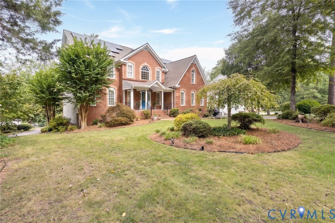 12669 Fawn Lane, Goochland, VA 23233 Brick exterior with white trim, arched windows, covered front entry, and mature landscaping