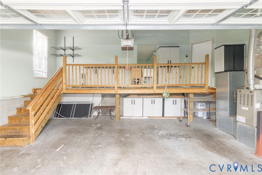 12669 Fawn Lane, Goochland, VA 23233 Concrete flooring and a white paneled garage door