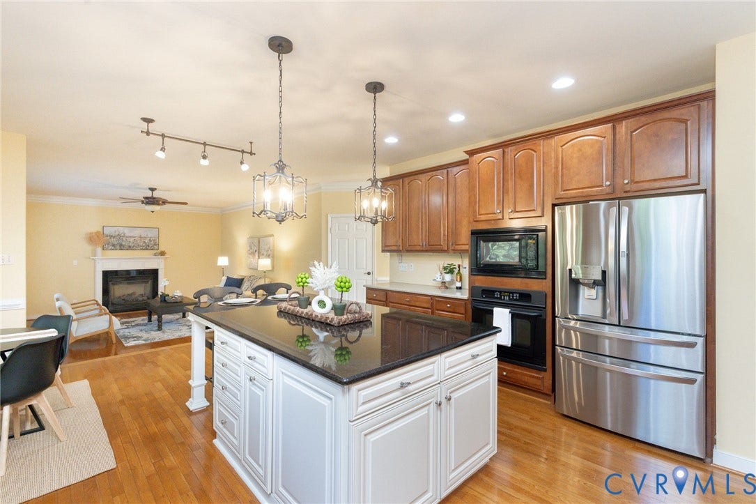 12669 Fawn Lane, Goochland, VA 23233 Kitchen island with dark countertop, stainless steel appliances, and wood-finish flooring