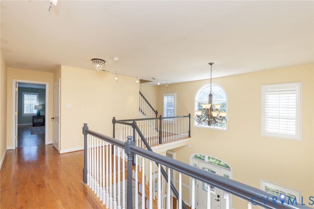 12669 Fawn Lane, Goochland, VA 23233 Hardwood flooring, white balusters, and dark railings