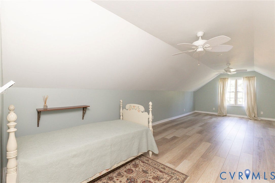 12669 Fawn Lane, Goochland, VA 23233 Sloped ceilings, wood-finish flooring, two ceiling fans, and a double window with drapes