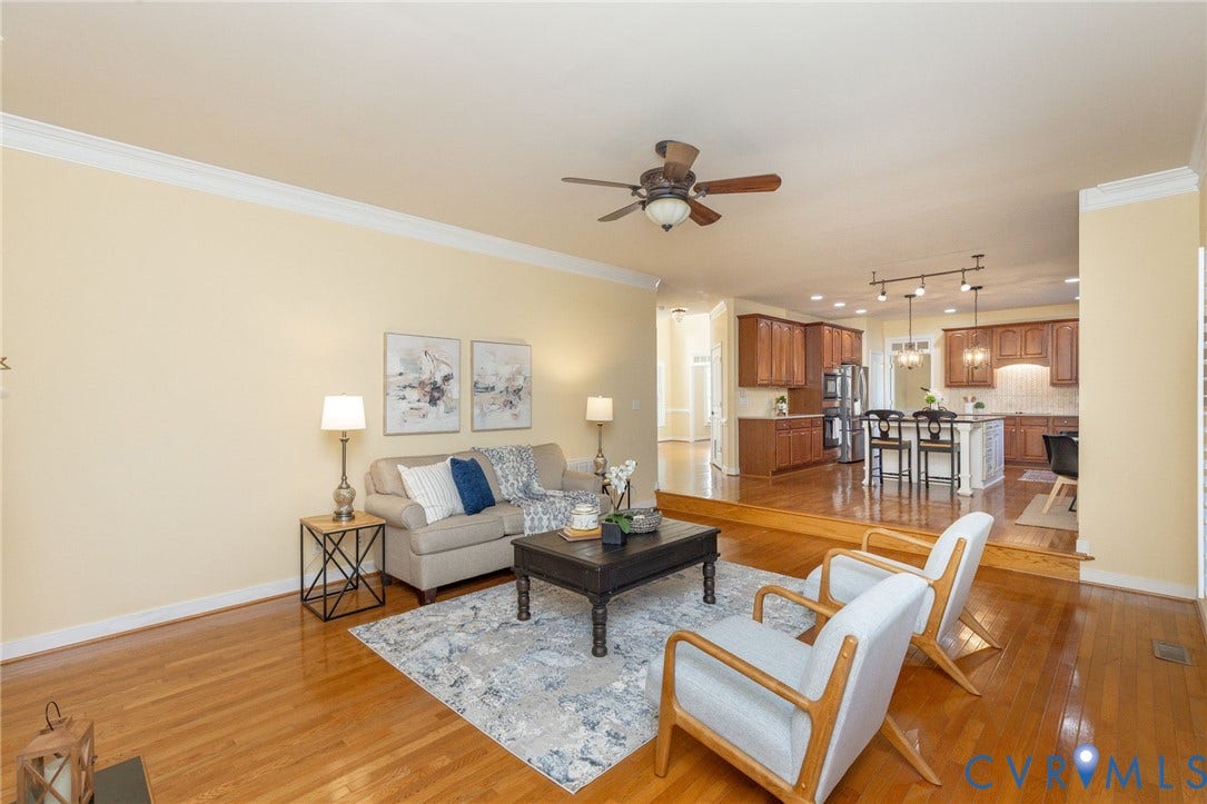 12669 Fawn Lane, Goochland, VA 23233 Hardwood flooring, crown molding, ceiling fan, recessed lighting, and kitchen island with seating