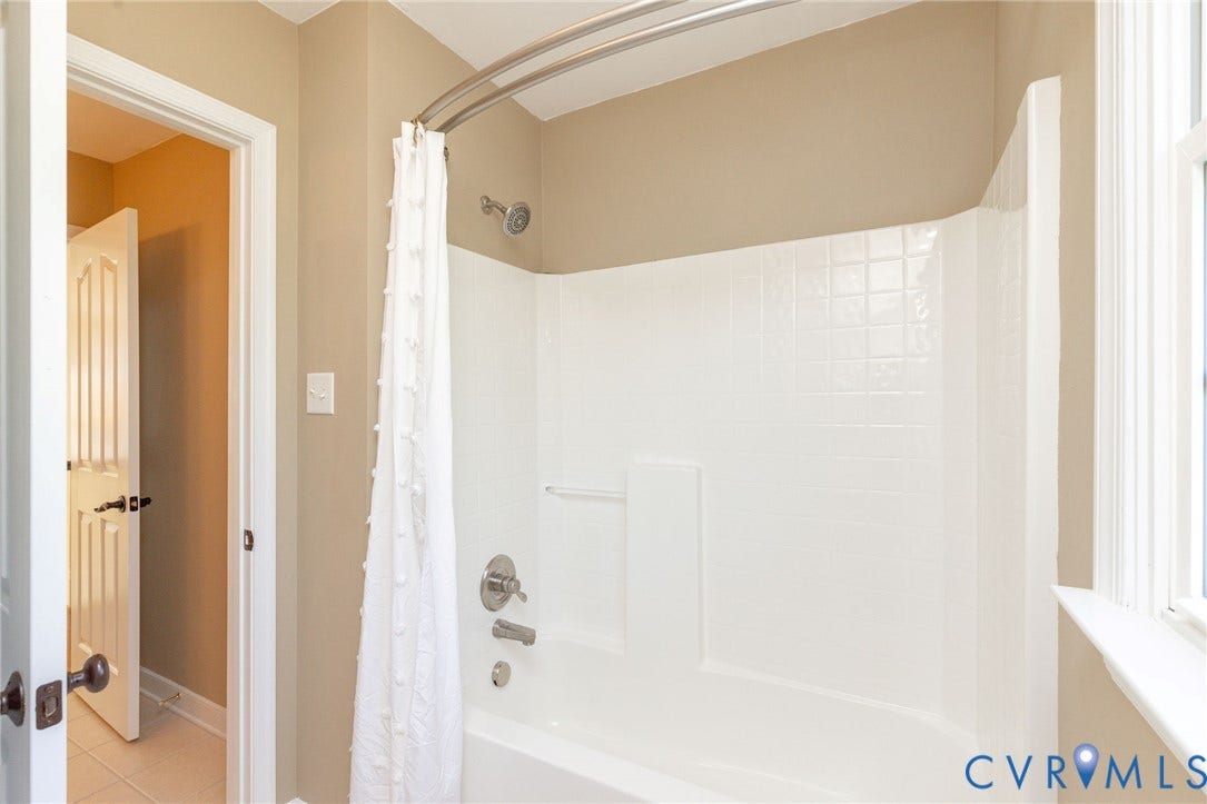 12669 Fawn Lane, Goochland, VA 23233 White tub and shower combination with chrome fixtures