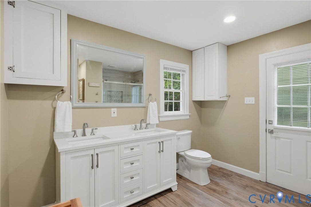 11150 Hames Lane, Glen Allen, VA 23059 First floor full bathroom with double vanity and one of the tankless water heaters