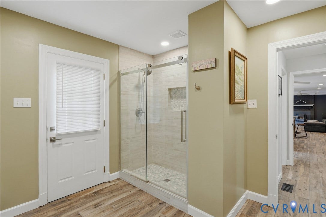 11150 Hames Lane, Glen Allen, VA 23059 First floor bathroom walk-in shower with clear glass enclosure, tiled shower walls, and tiled flooring