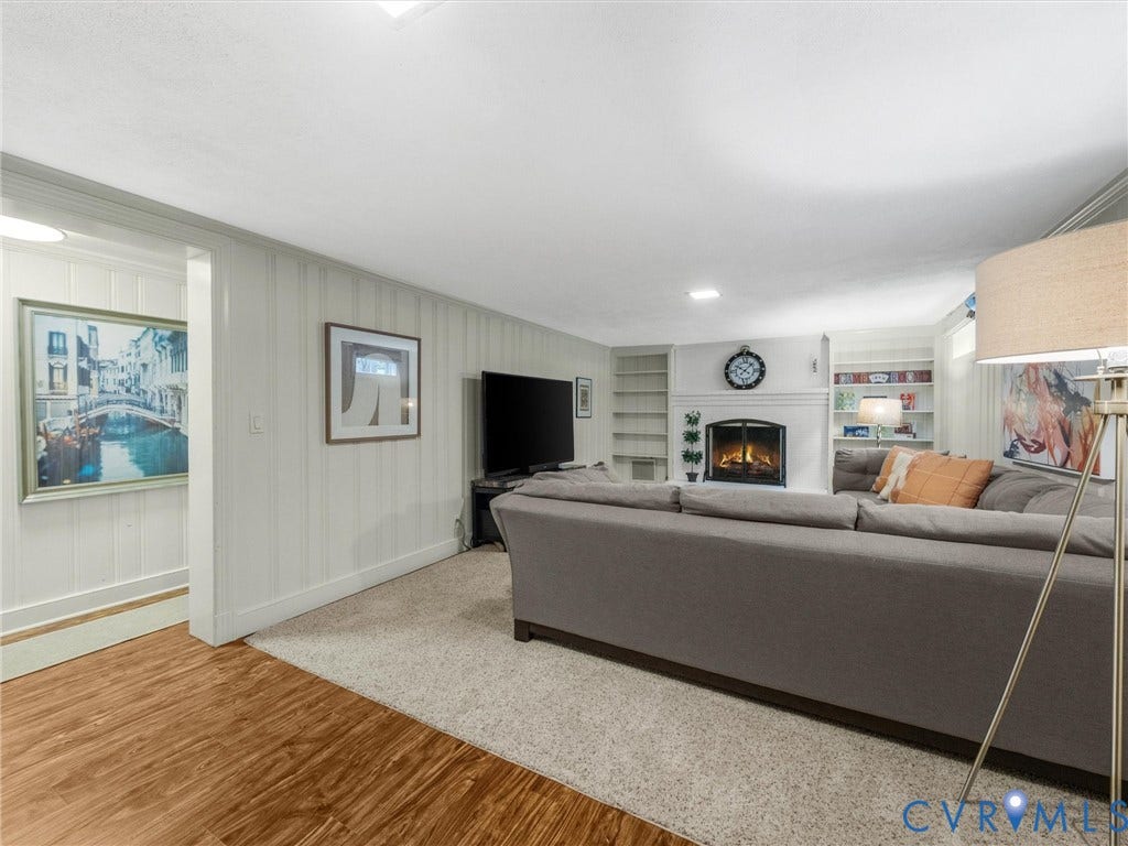 600 Baldwin Road, Henrico, VA 23229 Recessed lighting, fireplace with a white mantel, built-in shelving, carpeted flooring, and wood-finish flooring