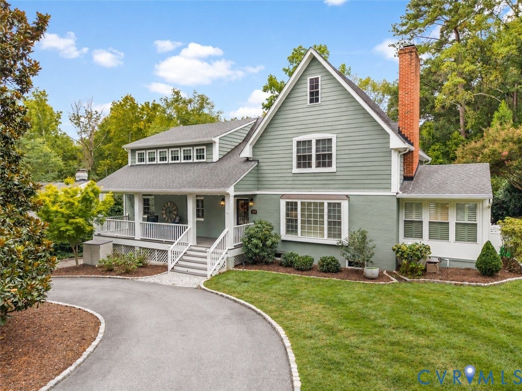 600 Baldwin Road, Henrico, VA 23229 Expansive front exterior featuring a covered porch with white railings, a prominent brick chimney, and a bay window